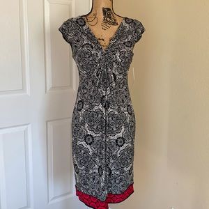 NWT London style sleeveless dress with bra shelf. Gathers around the bosom.